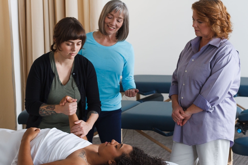 Massage instruction at East West College of the Healing Arts