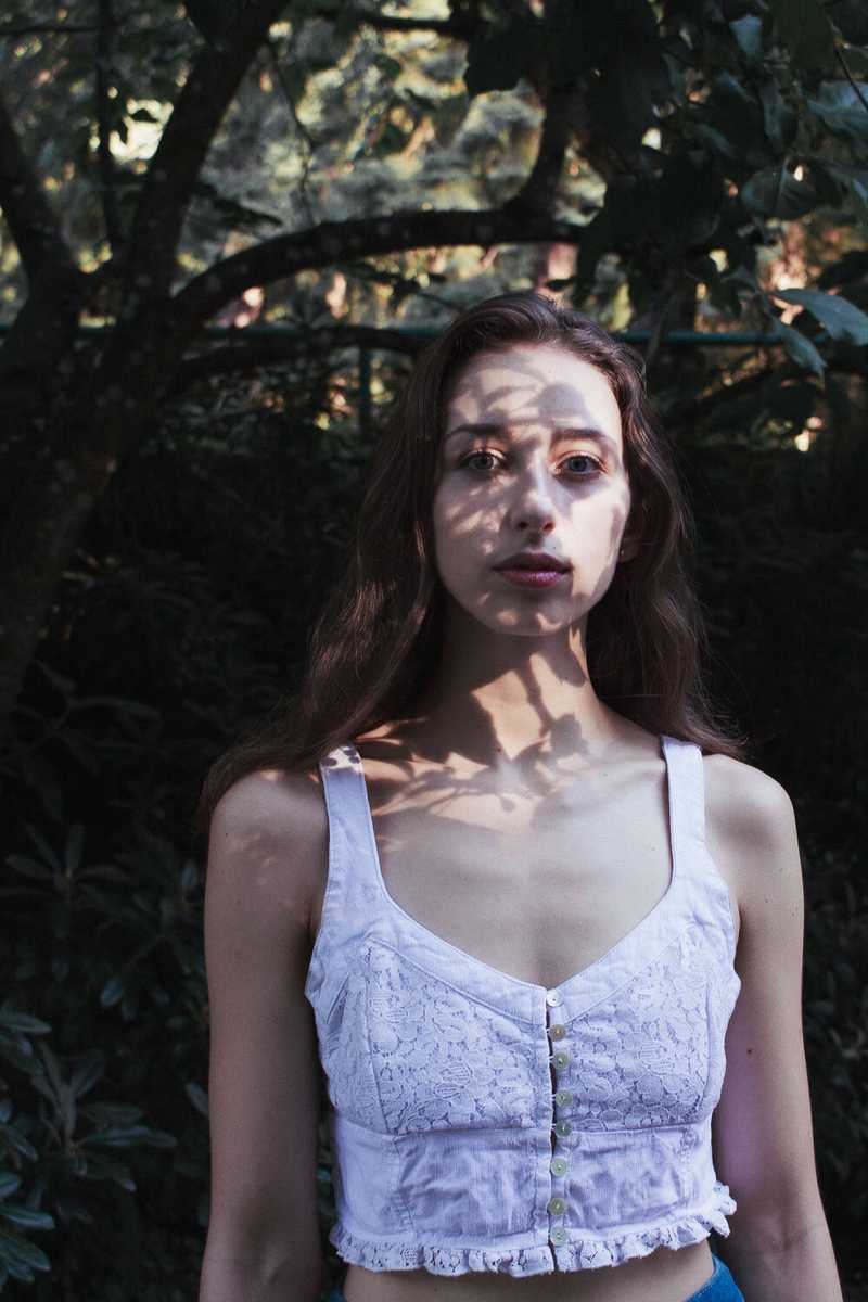 Model posing in a forest