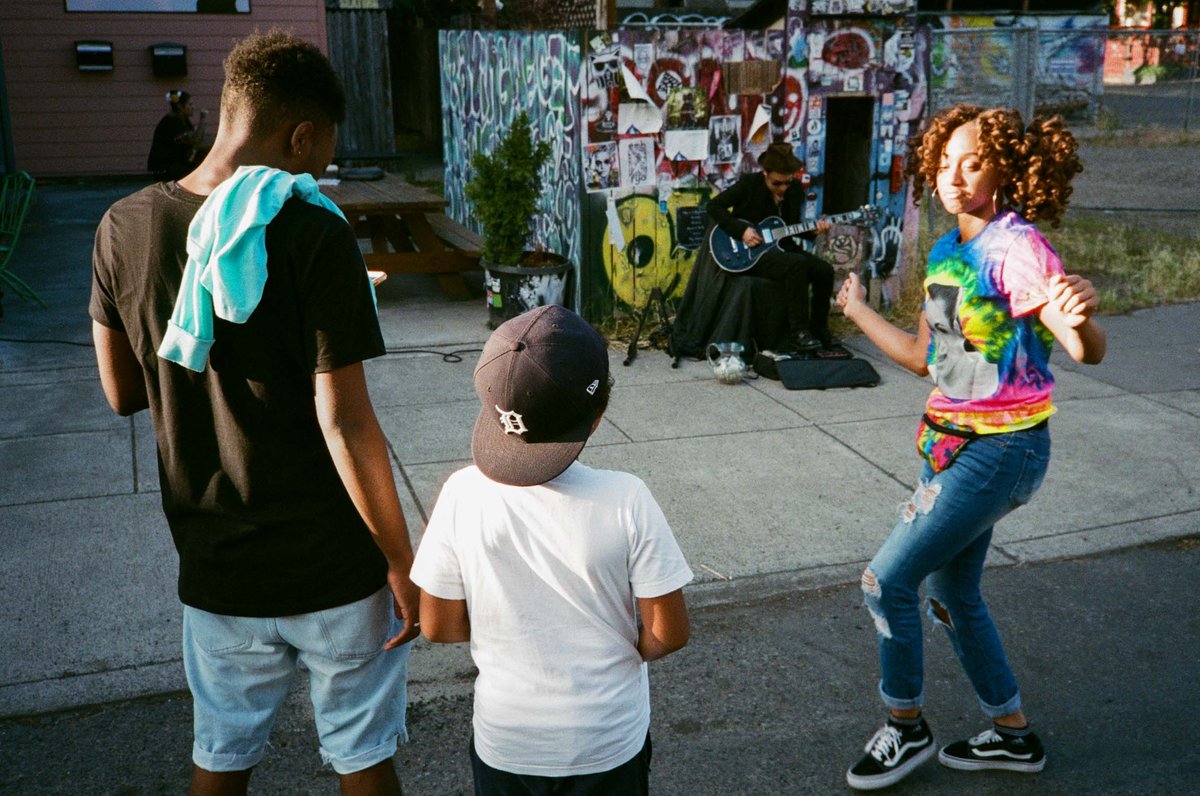 Girl dancing at Last Thursday on Alberta Street in Portland, OR