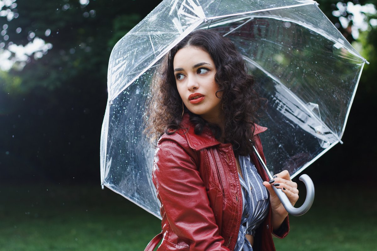 Model posing with an umbrella in Portland, OR