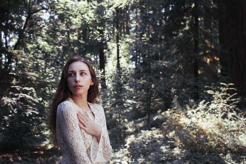 Model posing in a forest