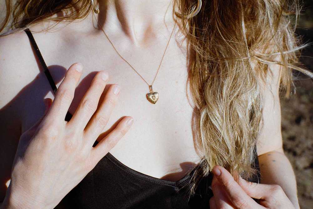 Romantic film photography closeup of a woman in a black dress