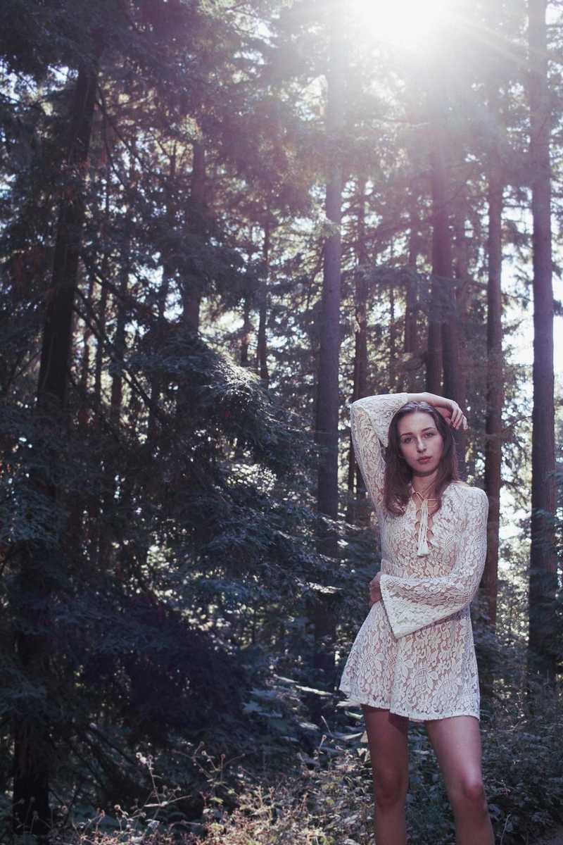 Model posing in a forest