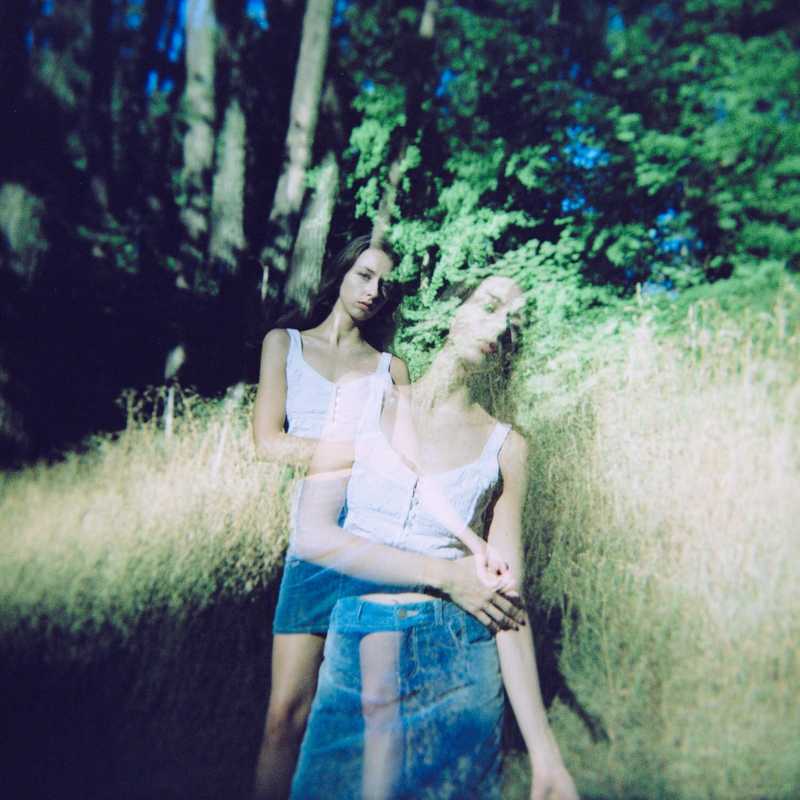 Model posing in a forest