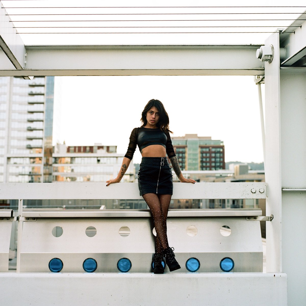 Model posing in front of the Portland skyline