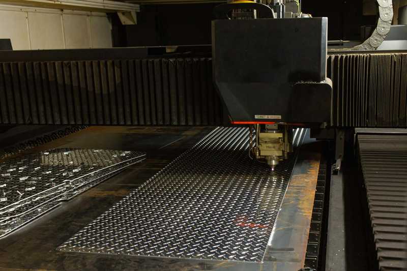 Laser cutting a piece of metal at Oregon Metal
Services