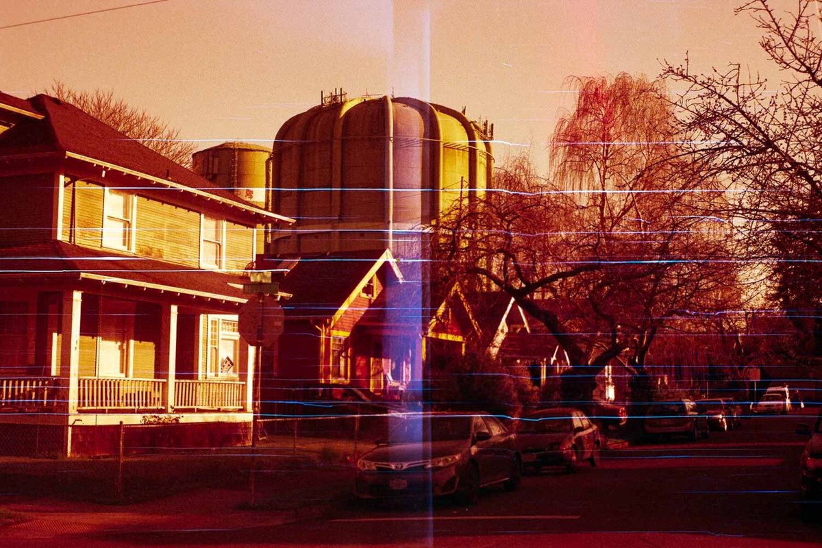 Redscale film photo of a neighborhood scene using Fuji Superia 400 film