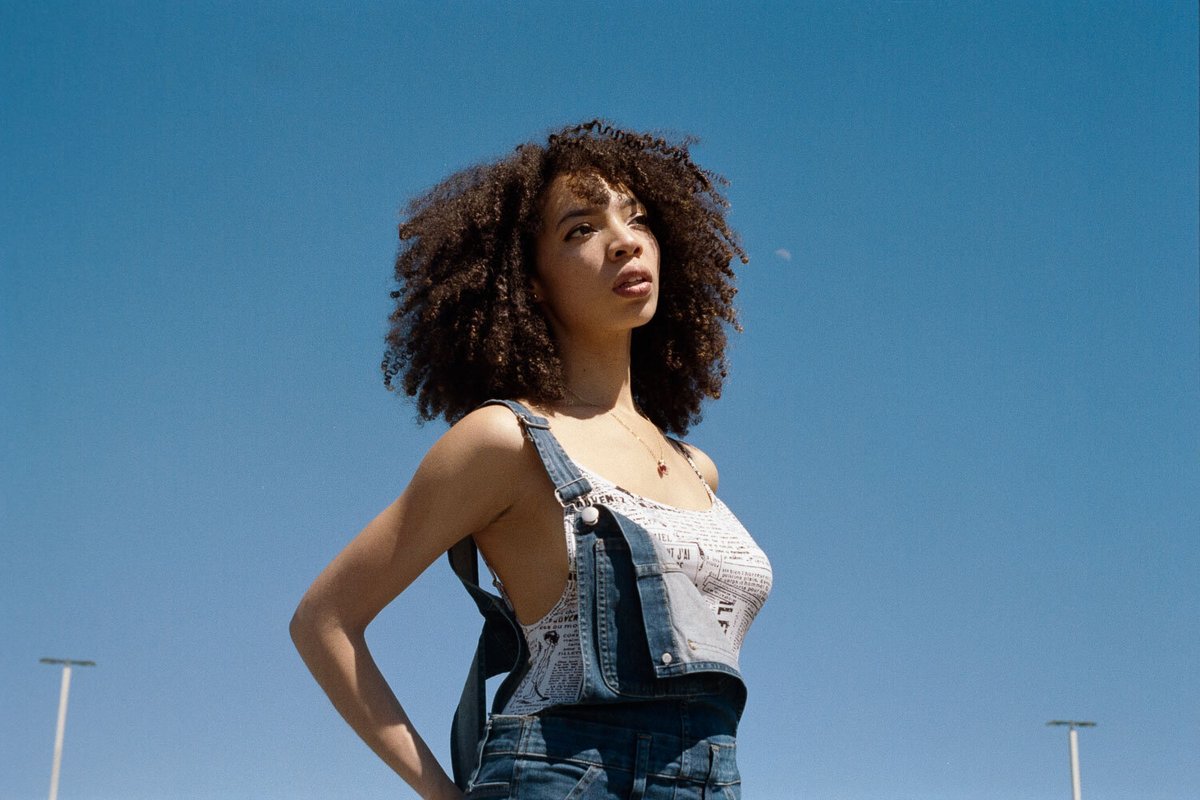 Model in looking into the distance with a pure blue sky in the background in Portland, OR